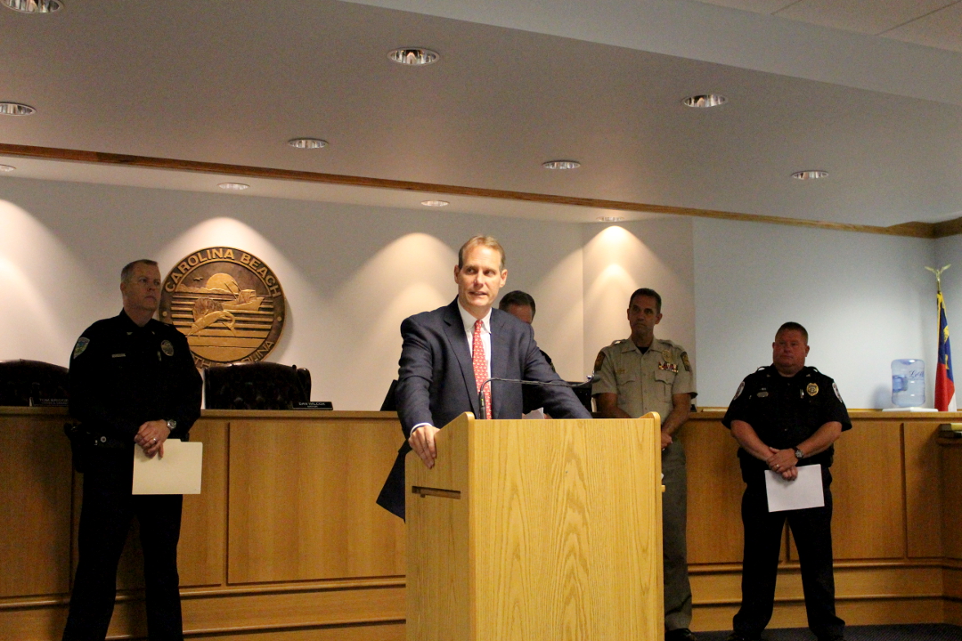 District Attorney Ben David at the podium, joined by local leaders , for an announcement in the death of a boy in a hot car. Photo by Christina Haley