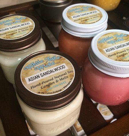 In just a year, Sharon Reynolds went from novice candle-maker to new business owner. She and husband Wayne opened White Lake Wicks in the Cotton Exchange in March. Photos by Hilary Snow.