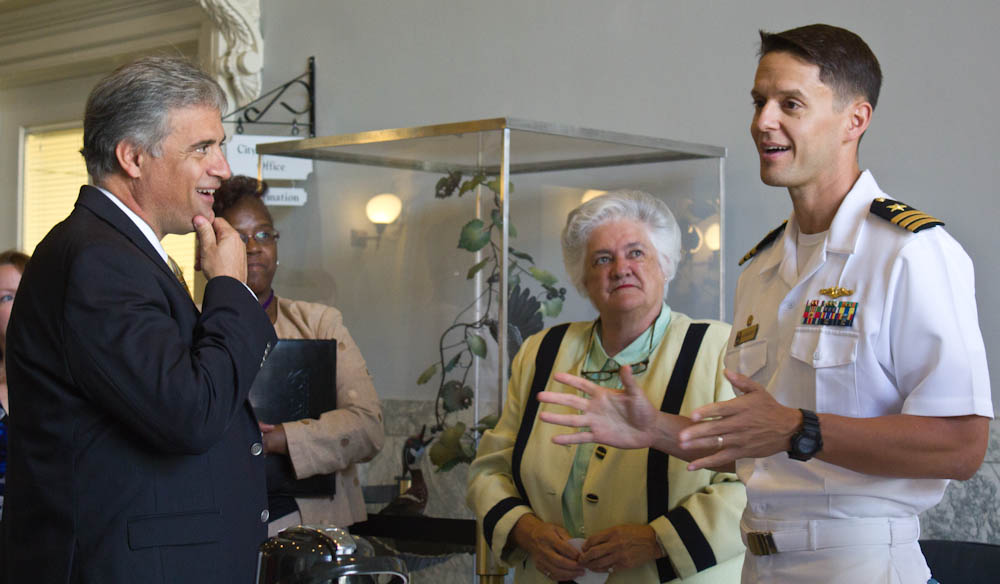Wilmington Mayor Bill Saffo, left, listens as U.S. Navy Commander Gary Montalvo, commanding officer of the submarine USS North Carolina, talks to city officials. Photo by Hannah Leyva.