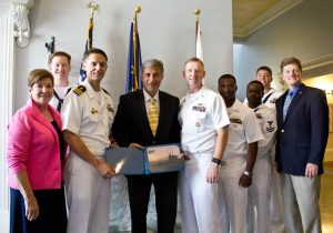 The commander and crew of the submarine USS North Carolina present a certificate to the mayor and city council members of Wilmington. Photo by Hannah Leyva.