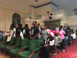 Black Lives Matter protesters stand in solidarity at Tuesday's Wilmington City Council meeting. Photo by Hannah Leyva.