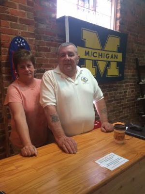 Sharon and her husband Wayne display their Michigan pride in their new store, named after the town in which they now reside. 