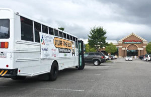 A bus parked at Harris Teeter in Mayfair Town Center will be filled with donated school supplies. Photo by Hannah Leyva.