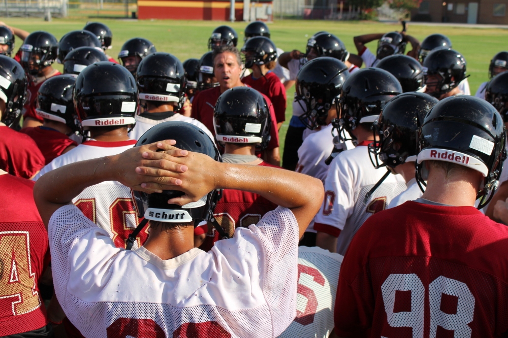 Coach jeff Turner rallies the team after early morning drills. 