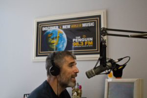 The Penguin's Eric Miller on air in the station's new studio. Photo by Hannah Leyva.
