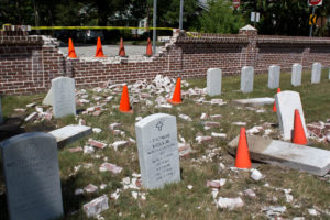 A vehicle struck a brick wall of the Wilmington National Cemetery at 20th and Princess Streets, causing damage to headstones. Photo by Hannah Leyva.