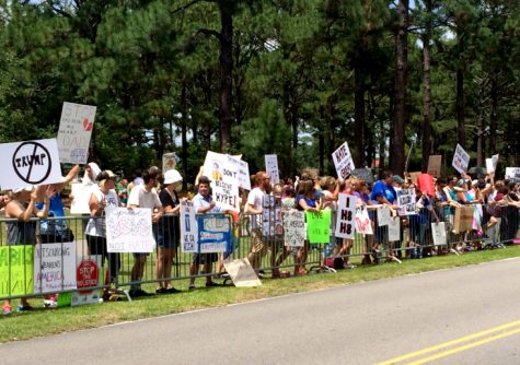 Protesters gathered outside the Donald Trump rally at UNCW's campus on Tuesday. Photo by Christina Haley.