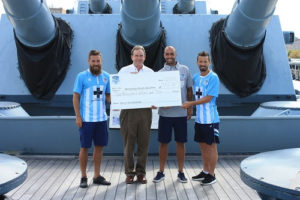 The Wilmington Hammerheads present a check to the Battleship North Carolina. Courtesy photo.