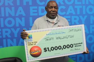 Parking lot attendant Terry Wallington, of Wilmington, won $1 million playing Powerball on Wednesday.