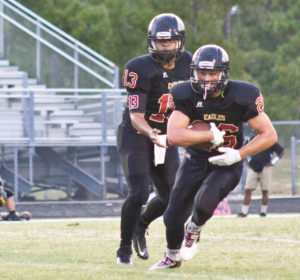 Ashley quarterback Jacob Reed (13) and running back Bradley Plyler. Photo by Hannah Leyva.