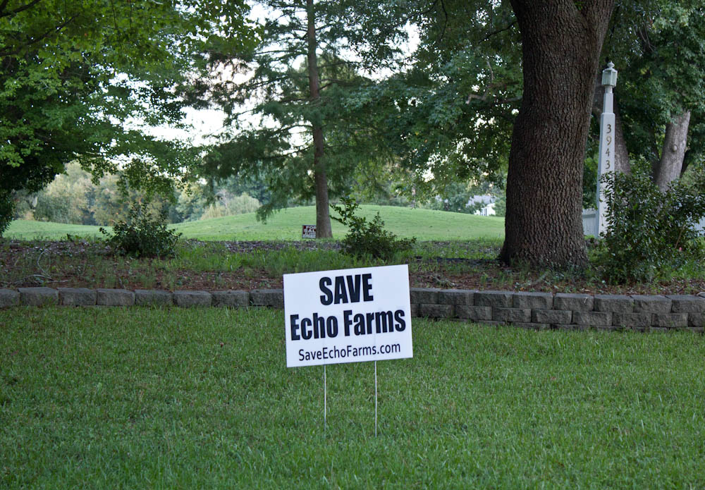 A Save Echo Farms sign sits in front of one of the golf course's fairways that could be developed into more housing. Photo by Hannah Leyva.