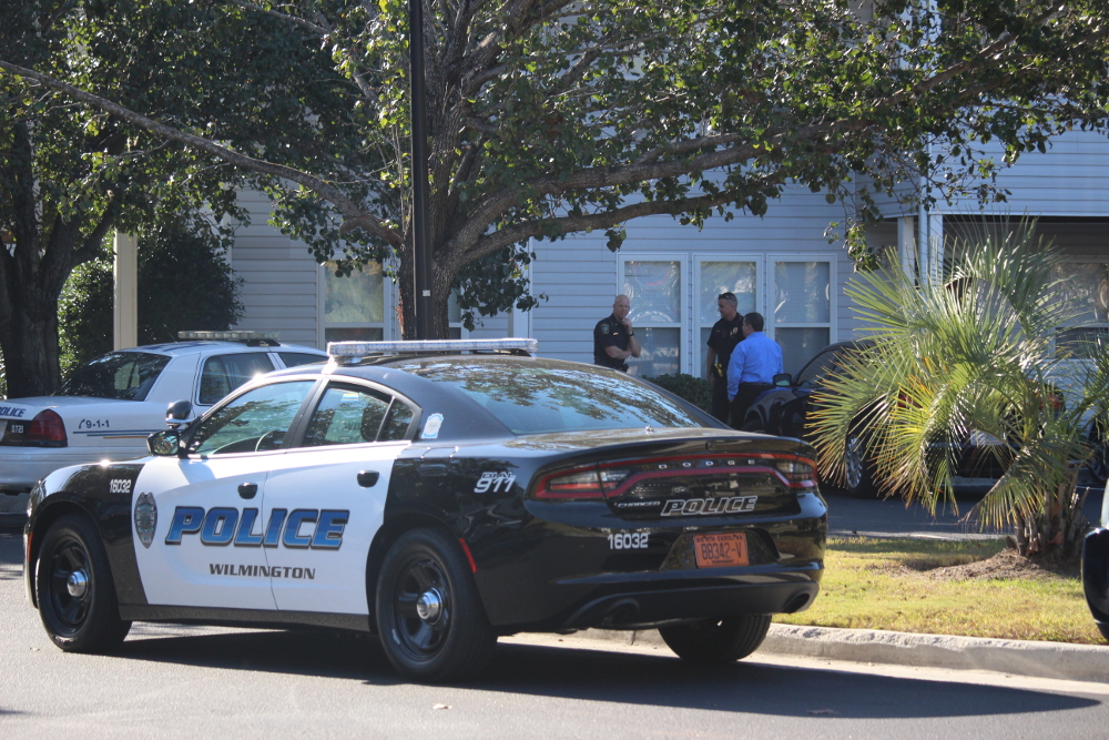 Police outside the scene of an apartment where a woman in her 20s was found dead. (Photo by Christina Haley)