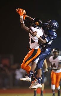 Malcom Hill, left, makes a tough catch with Keon Bradley on the defense. Photo courtesy- John Crouch