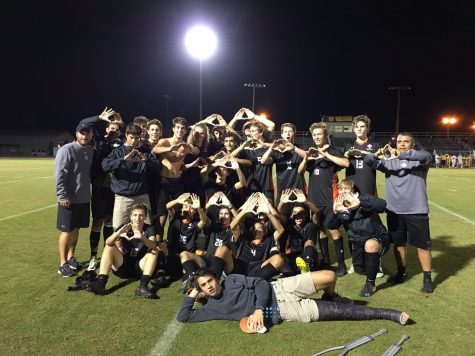 Coach TJ Rennie and the New Hanover Wildcats are this year's conference champions. Photo courtesy- John Hinnant. 