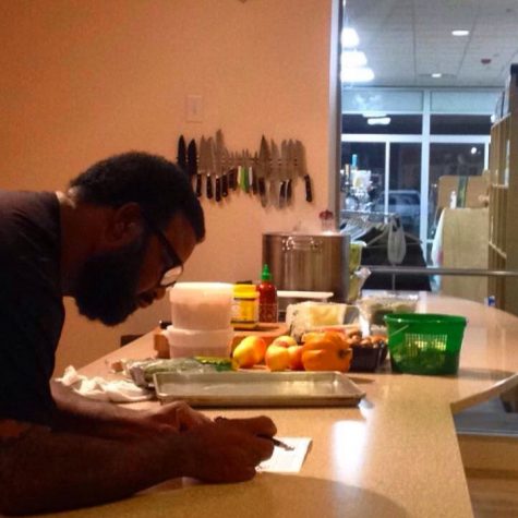 Chef Rhodes reviews a checklist while teaching a cooking class at The Seasoned Gourmet. (Photo courtesy Casey Schachtman)