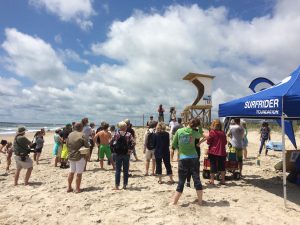 Chapter President Ethan Crouch at Hands Across the Sand event. (Courtesy: Cape Fear Surfrider Chapter)