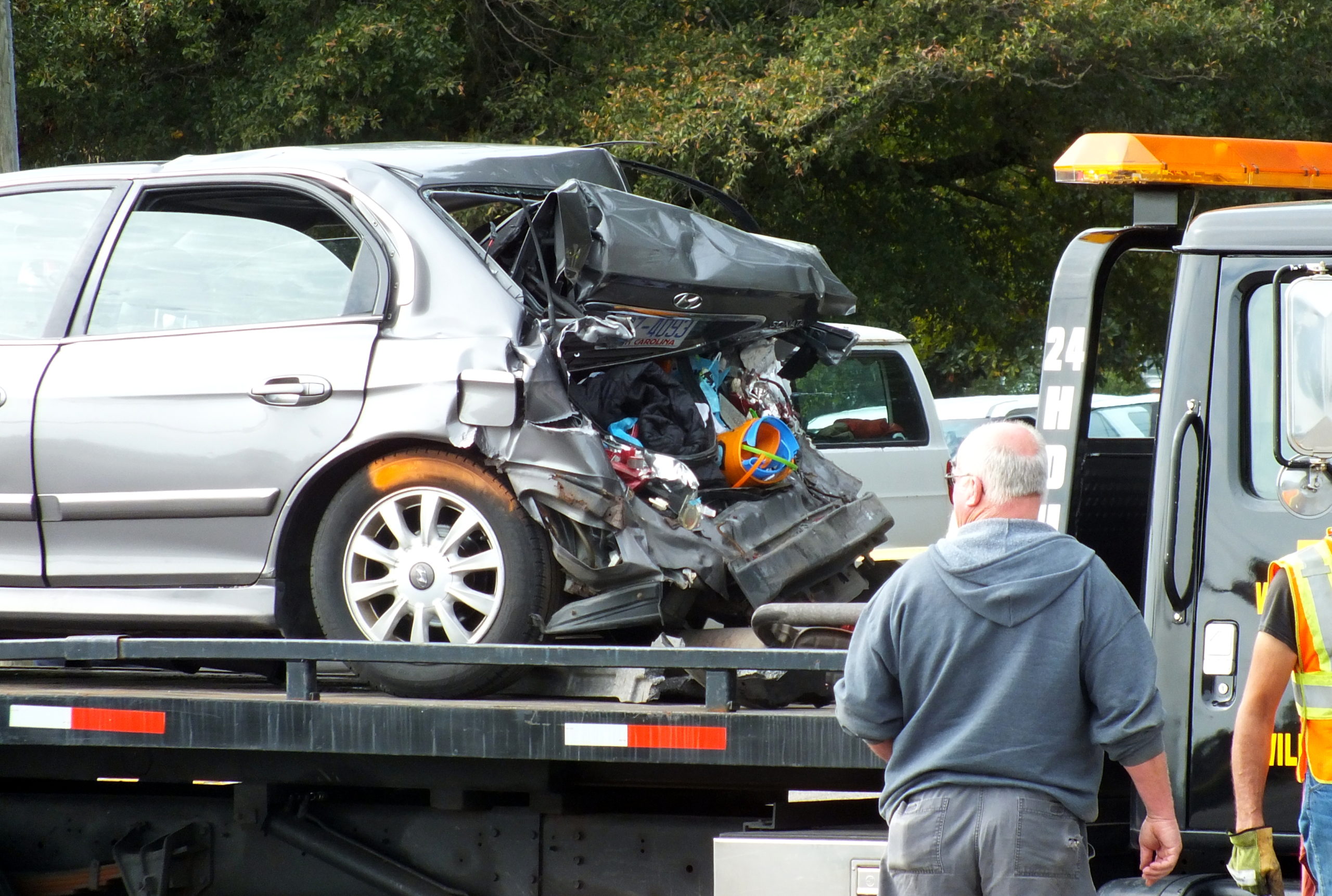 The victims' vehicle was pulled away from the scene hours after a pick-up struck the family from behind. Photo by Christina Haley.