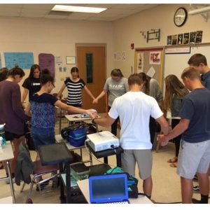 A small group meet for an early morning 'huddle' at Ashley High School. Photo courtesy- Matt Treppel