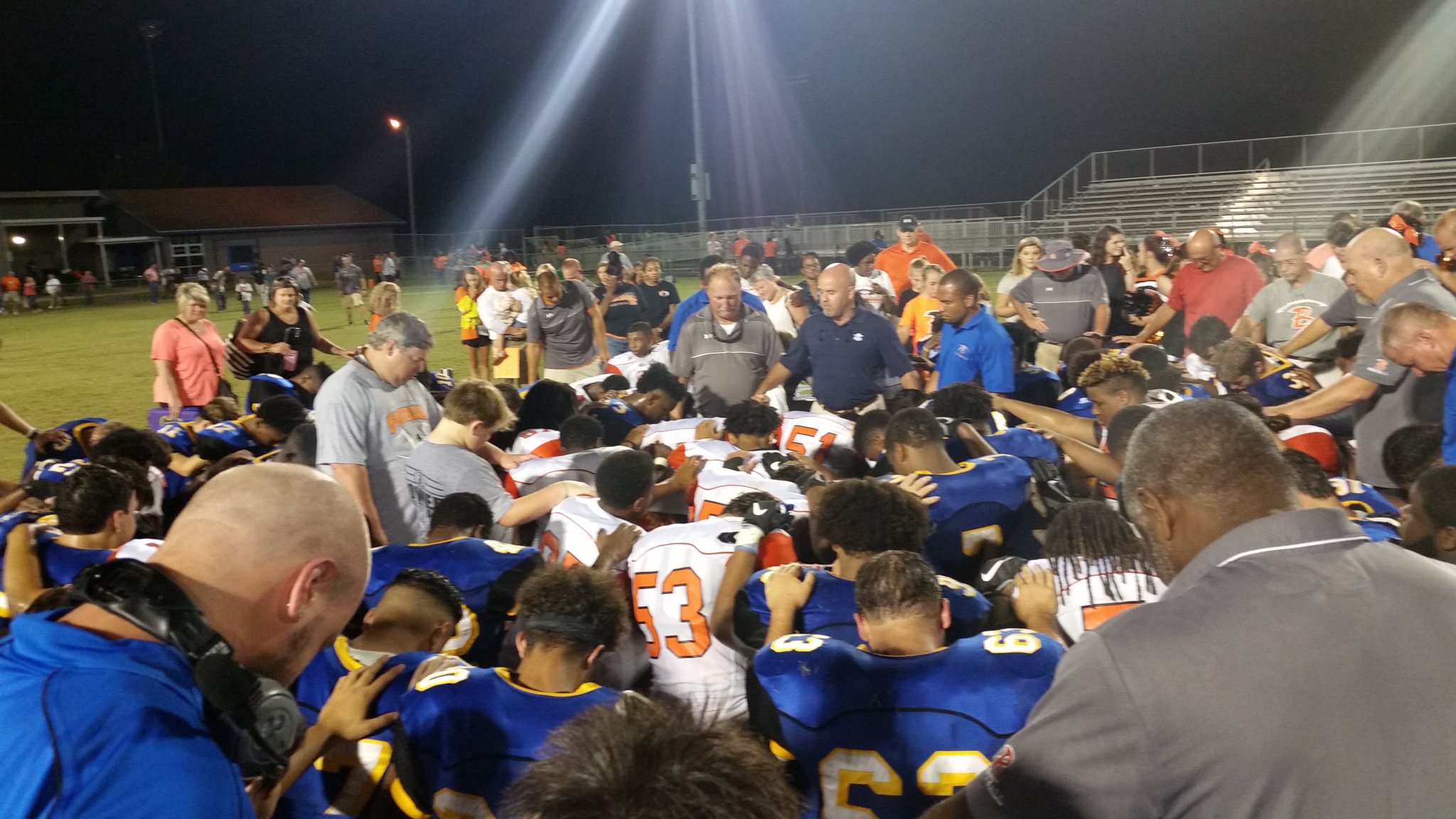 The Laney and Wallace-Rose Hill football teams met for a moment of prayer after their game this fall. 