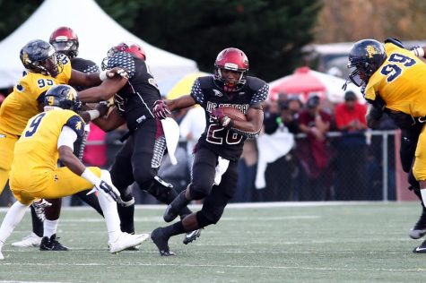 Ramone Simpson hits the hole against North Carolina A&T. Photo courtesy- NC Central Athletics