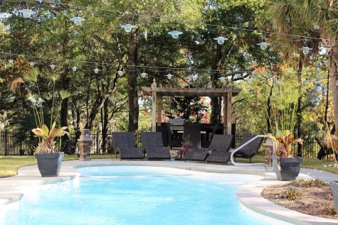 The home has a heated saltwater pool and Jacuzzi.