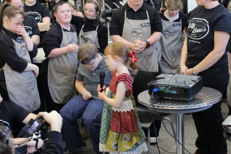 Beau (left) and Bitty (right, with microphone), namesakes of the coffee shop, along with some of the store's staff. (Port City Daily photo / BENJAMIN SCHACHTMAN)