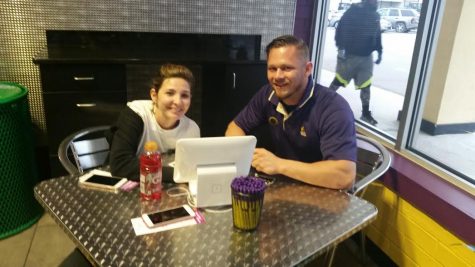 David Resveck, right, welcomes a new member to the Planet Fitness on Kerr Avenue. 