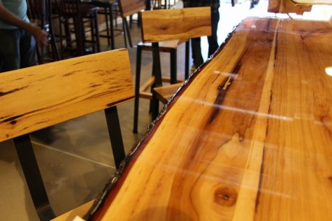 The tables, stools and bar were all made from the trees on the site. The bar was hewed on site.