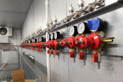 The brewery's tap cooler, located directly behind the bar. has 40 taps and short lines that allow easy cleaning.