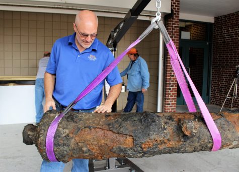 McKee checking the bolt placed at the rear of the cannon.