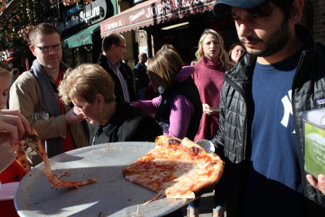 Grabbing a slice in front of Famous Joe's Pizza. (Photos courtesy Allison Carter)