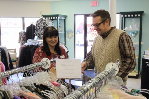 Jennifer Murrill, assistant manger, and Todd Beane, operations manager at the CIS store, discuss selection and pricing. (Photo by Benjamin Schachtman)