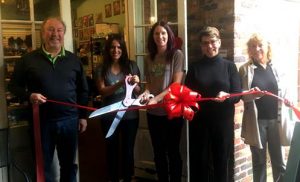 At the ribbon cutting Ceremony for Coastal Paws are (from left) Ed Wolverton of WDI, Kathleen White (co-owner), Ruthie Halko (co-owner), Mayor Pro-Tem Margaret Haynes and Nancy Bullock (Cotton Exchange).