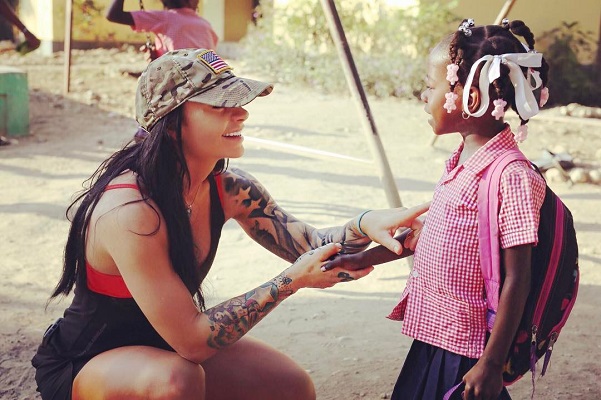 Ashley Horner with a child from the Maison Fortune Orphanage and Primary School located in Hinche, Haiti in December. (Photo courtesy Ashley Horner)