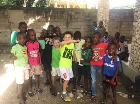 Horner's son, Cash, centre, with children from the Maison Fortune Orphanage and Primary School located in Hinche, Haiti last December. (Photo courtesy Ashely Horner)