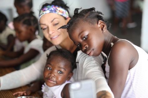 Ashley Horner visits with children from the Maison Fortune Orphanage and Primary School located in Hinche, Haiti in December. (Photo courtesy Ashley Horner)