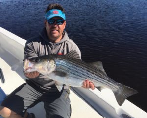 Capt. Jot Owens with a NICE Cape Fear River Striper. (Courtesy: Capt. Jot Owens)