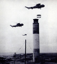 Helicopters lowering in the top section of lighthouse