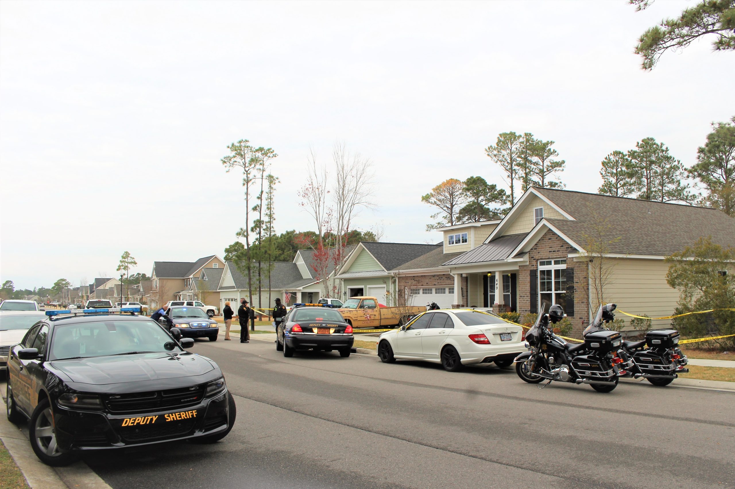 New Hanover County Detectives at the scene of a shooting incident on Julia Drive in the Sycamore Grove neighborhood. (Photo by Christina Haley.)