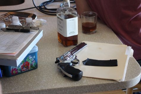 Marvel’s ‘Iron Man 3’ had a budget of $200 million; Chic Scaparo’s ‘Beatrice’ had a budget of $3,000. This prop gun and North Carolina distilled Defiant whiskey, like nearly everything else on the set, were donated. (Photo Benjamin Schachtman)