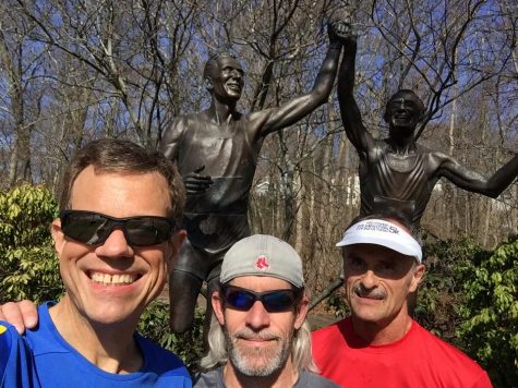 From left, Stuart Ross, Rick Poplaski and Mark Claycomb during a Saturday morning run on the marathon route at the famous Johnny Kelley statue on Commonwealth Avenue. (Port City Daily photo/COURTESY OF STUART ROSS)