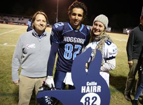 Collin Hairr and his family enjoy senior night festivities last fall. Photo courtesy- John Crouch. 