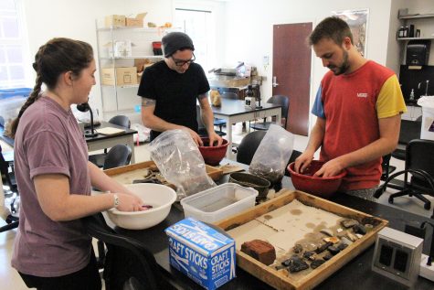 Student volunteers joined in on Friday, to help wash the artifacts.