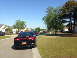 Deputies responding to a shooting at an Ogden area home that killed Yancey Edwards. (Photo by Christina Haley.)