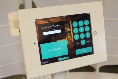 BarMembership's design runs on an iPad, secured inside a locally-manufactured steel frame that holds IDs steady. (Port City Daily photo / BENJAMIN SCHACHTMAN)