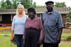 Kristen Johnson (L), with Martha Corbett (M), and Fred Corbett (R). After seven months, their homes are finally being repaired. (Port City Daily photo/CORY MANNION)