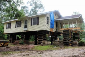 The Johnson home after being lifted this morning. (Port City Daily photo/CORY MANNION)