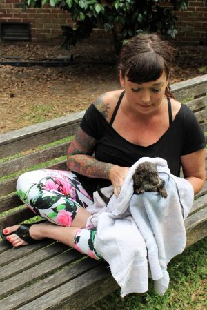 Natalie Johnston drying off otter Delilah after her swim.