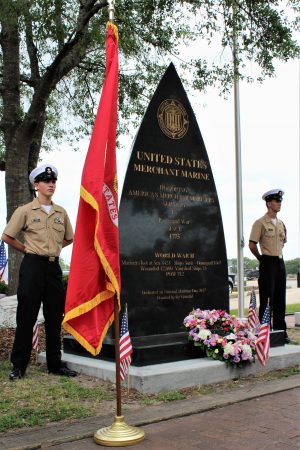 Members of the Ashley High School Color Guard stand watch at the memorial.