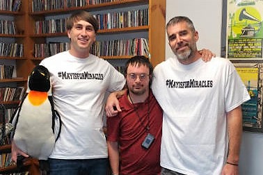 Miracle League of Wilmington player Craig Lendino visited 98.3 FM The Penguin on Friday. Joining him for a photo were afternoon on-air hosts Beau Gunn (left) and Eric Miller. (Port City Daily photo/COURTESY ERIC MILLER)